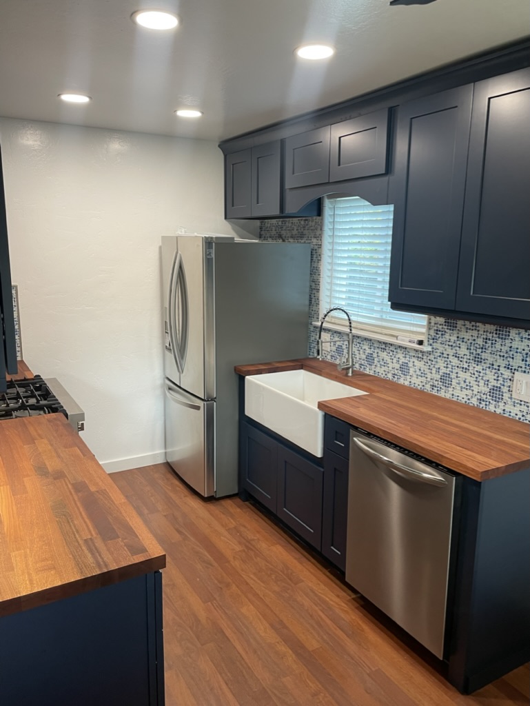 Contemporary condo kitchen with modern appliances in Pacifica